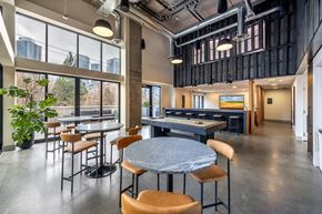 Seattle apartment for rent - A modern dining area with a large table and chairs.