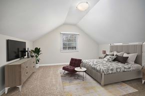 Chapel Hill apartment for rent - a bedroom with a bed and a dresser and a tv