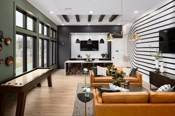 Gallatin apartment for rent - A modern living room with a pool table and a striped wall.