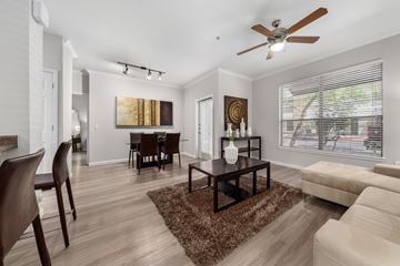 Phoenix apartment for rent - A living room with a brown rug and a brown coffee table.