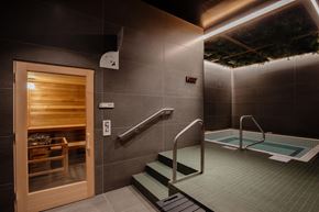 Hillsboro apartment for rent - A small indoor swimming pool with a wooden door.