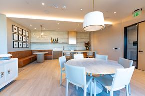 Burlingame apartment for rent - A modern dining room with a round table and white chairs.