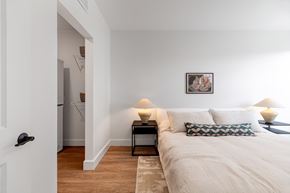 Denver apartment for rent - A bedroom with a bed, nightstand, and lamp.