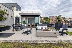 Seattle apartment for rent - A modern outdoor patio with a fire pit and seating area.