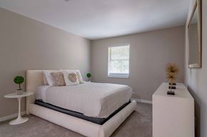 Roswell apartment for rent - Roswell Creek bedroom with a white bed and a white table
