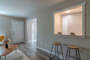 Roswell apartment for rent - Roswell Creek  living room with two bar stools looking into the kitchen