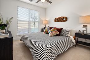 Nashville apartment for rent - a bedroom with a bed and a ceiling fan