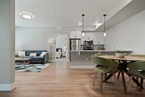 Boise apartment for rent - A modern kitchen with a dining table and chairs.