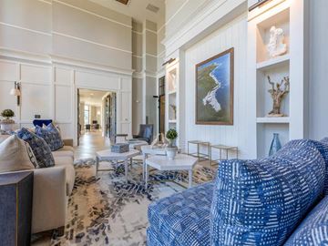Charleston apartment for rent - a living room with blue and white furniture and a painting on the wall
