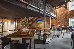 Salt Lake City apartment for rent - A modern dining area with a wooden table and chairs.