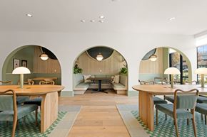 Charlotte apartment for rent - A modern dining room with wooden tables and chairs.