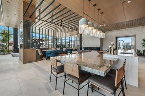 Phoenix apartment for rent - A modern dining room with a large table and chairs in the club room