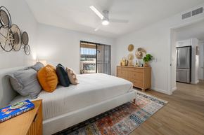 Chandler apartment for rent - a bedroom with a bed and a refrigerator