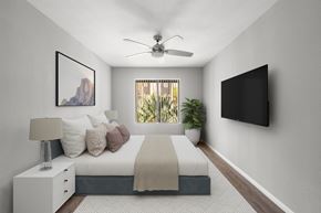 Santee apartment for rent - A bedroom with a bed, nightstand, and a painting on the wall.