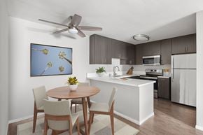 Santee apartment for rent - A modern kitchen with a dining table and chairs.