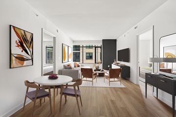 Arlington apartment for rent - A modern living room with a dining table and chairs.