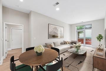 Reston apartment for rent - A modern living room with a wooden table and chairs.