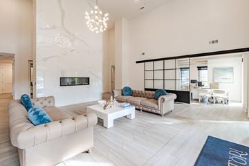 Johns Island apartment for rent - A modern living room with a large couch and a television.