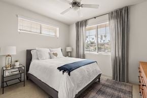 La Mesa apartment for rent - A bedroom with a large bed and a ceiling fan.