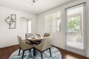 La Mesa apartment for rent - A dining room with a table set for two and a wall art.