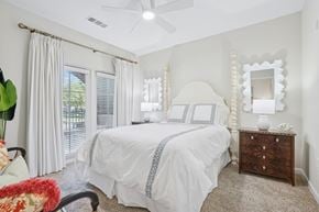 Charleston apartment for rent - A bedroom with a bed, dresser, and mirror.