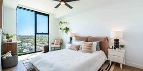 Phoenix apartment for rent - a bedroom with a large bed and a large window