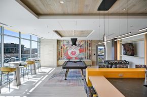 Washington apartment for rent - a games room with a ping pong table and a foosball table