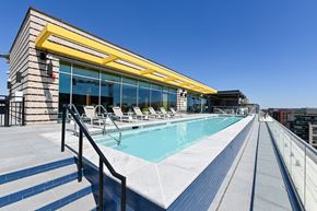 Washington apartment for rent - a pool on the rooftop of a building with a blue sky in the background