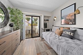 Glendale apartment for rent - a bedroom with a bed and a sliding glass door to a patio