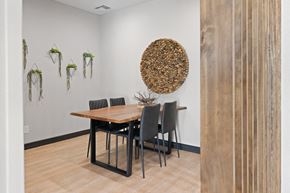Glendale apartment for rent - a dining room with a wooden table and black chairs