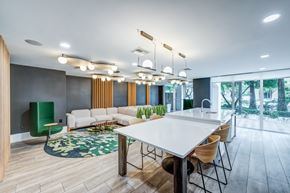 Fort Lauderdale apartment for rent - A modern dining room with a white table and chairs.