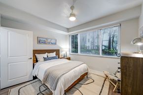 Fort Lauderdale apartment for rent - A bedroom with a bed, a bench, and a window with blinds.