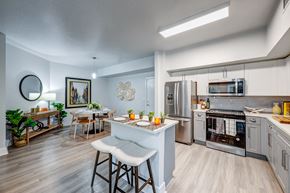 Fort Lauderdale apartment for rent - A modern kitchen with a dining table and chairs.