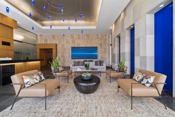 Los Angeles apartment for rent - A modern living room with a large rug and a coffee table.