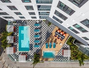 Long Beach apartment for rent - a rendering of the pool area of a hotel with a swimming pool and lounge chairs