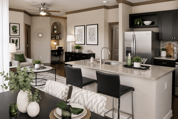 Woodbridge apartment for rent - A modern kitchen with a dining table set for two.