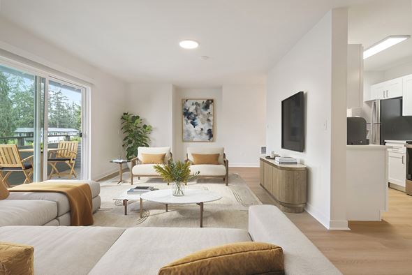 Bellevue apartment for rent - A modern living room with a grey sofa and a coffee table.