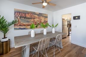 Ewa Beach apartment for rent - A dining room with a wooden table and chairs.