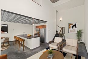 Seattle apartment for rent - Living room with a kitchen and a dining room