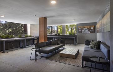 Pasadena apartment for rent - A modern living room with a grey couch and a coffee table.
