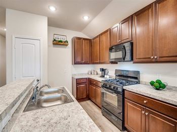 A kitchen with a sink and a stove