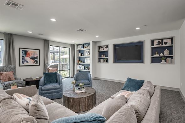 Houston apartment for rent - a living room with couches and chairs and a television
