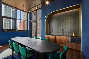 New York apartment for rent - A modern dining room with a large table and chairs.
