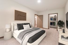 Seattle apartment for rent - A bedroom with a large bed and a wardrobe.