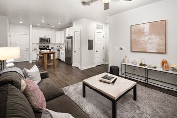 Brentwood apartment for rent - a living room with a couch and a coffee table and a kitchen