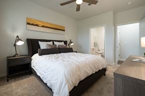 Brentwood apartment for rent - a bedroom with a bed and a ceiling fan