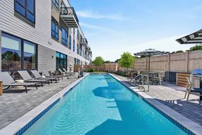 Salem apartment for rent - A long rectangular pool with a white border and blue water.