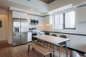 Glendale apartment for rent - A modern kitchen with a table and chairs.