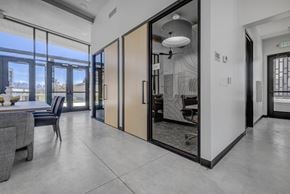 Lehi apartment for rent - A modern interior with a dining area and a view of the city.