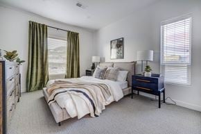 Lehi apartment for rent - a bedroom with a bed and a dresser and windows